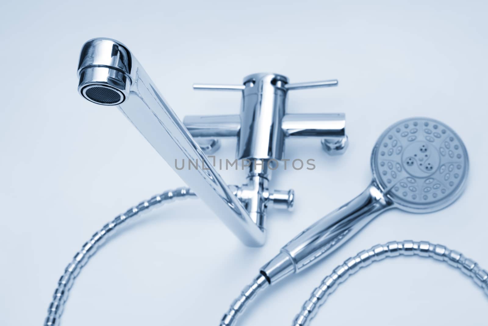 modern metal faucet and shower close up