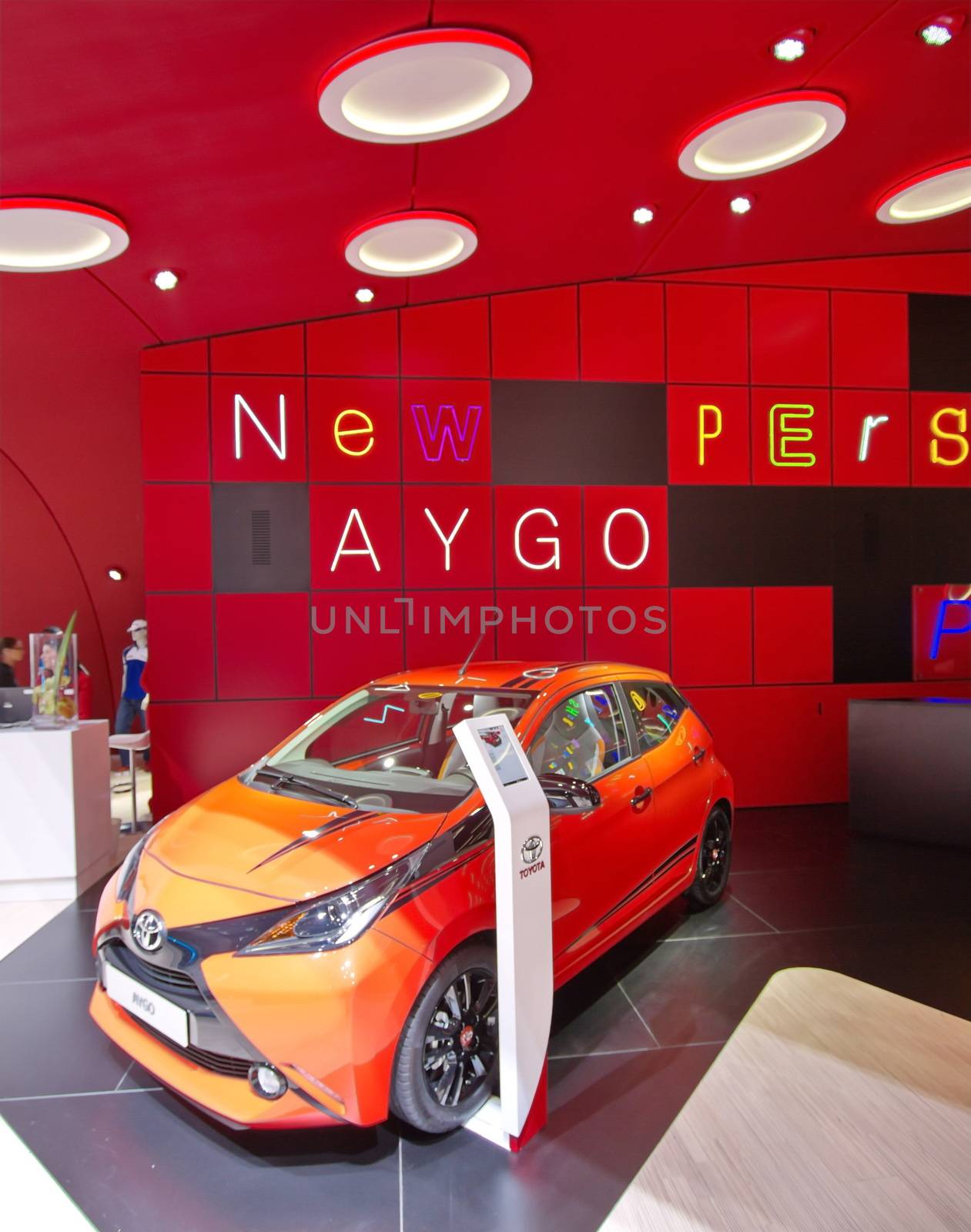 GENEVA - MARCH 13 : orange Aygo Toyota on display at the 84th International Motor Show Palexpo - Geneva on March 13, 2014 in Geneva, Switzerland.