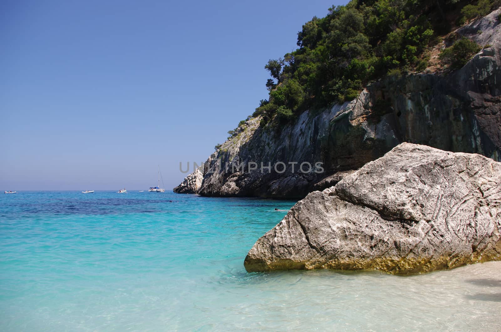 Beach "Cala Goloritze" in Sardinia. This beautiful bay is located on the eastern coast of Sardinia. It is accessible by boat or on foot via a path through the rugged mountains.