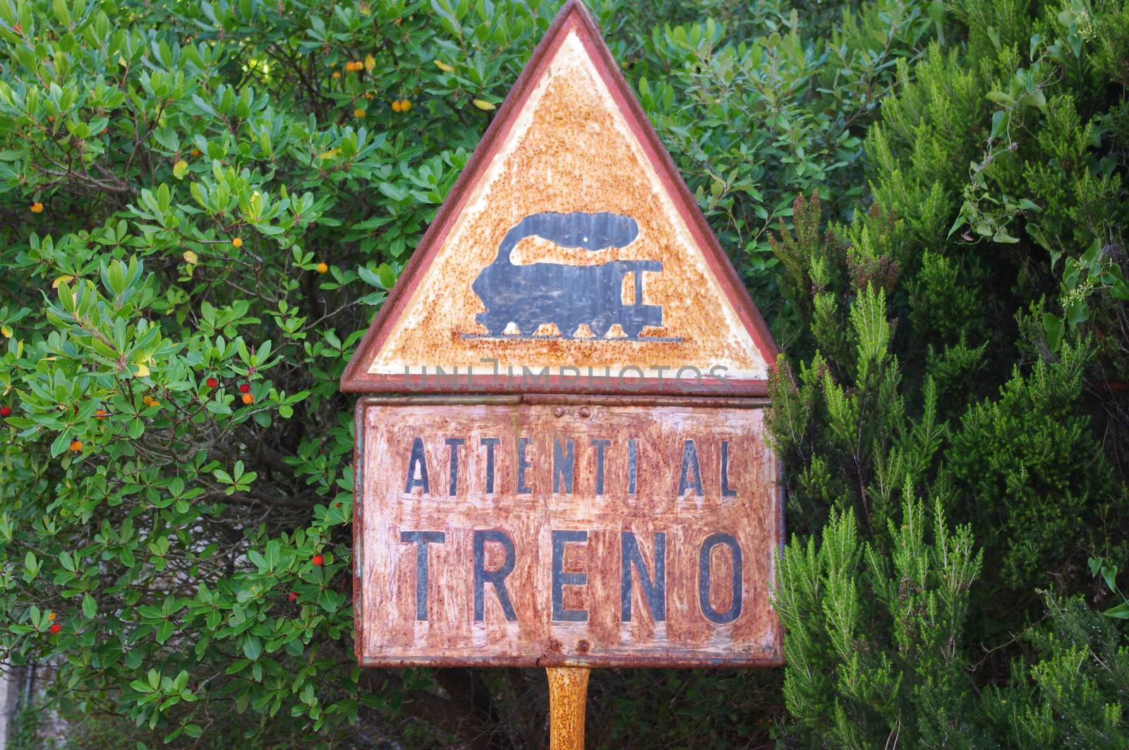 Old rusty sign: beware of the train. This sign was photographed in Montevecchio mine. (Sardinia)