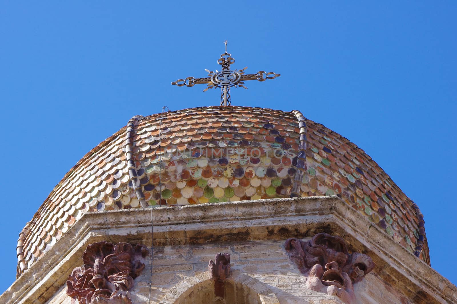 Detail of the dome and the Christian cross.