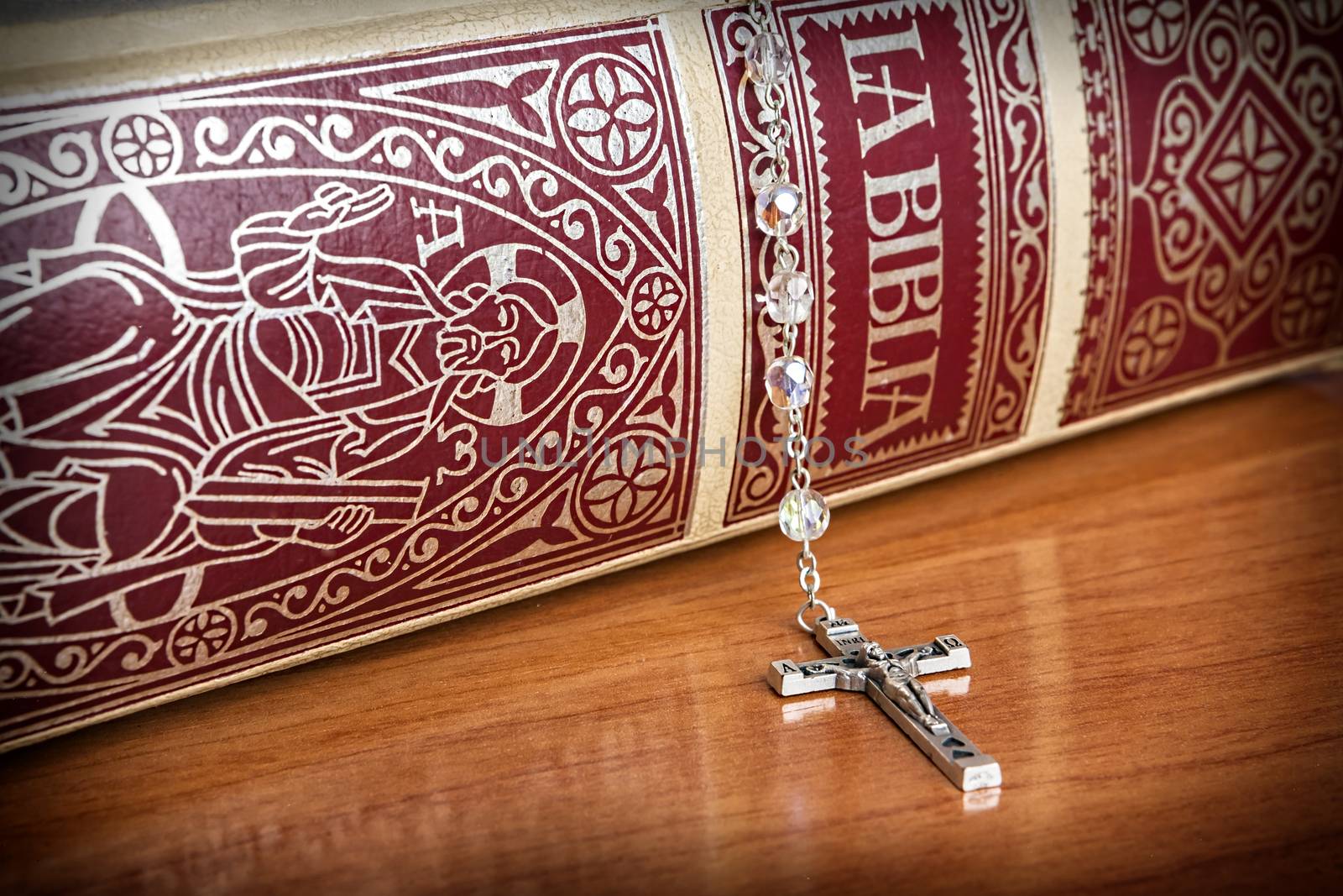 Rosary beads and a holy bible by digicomphoto