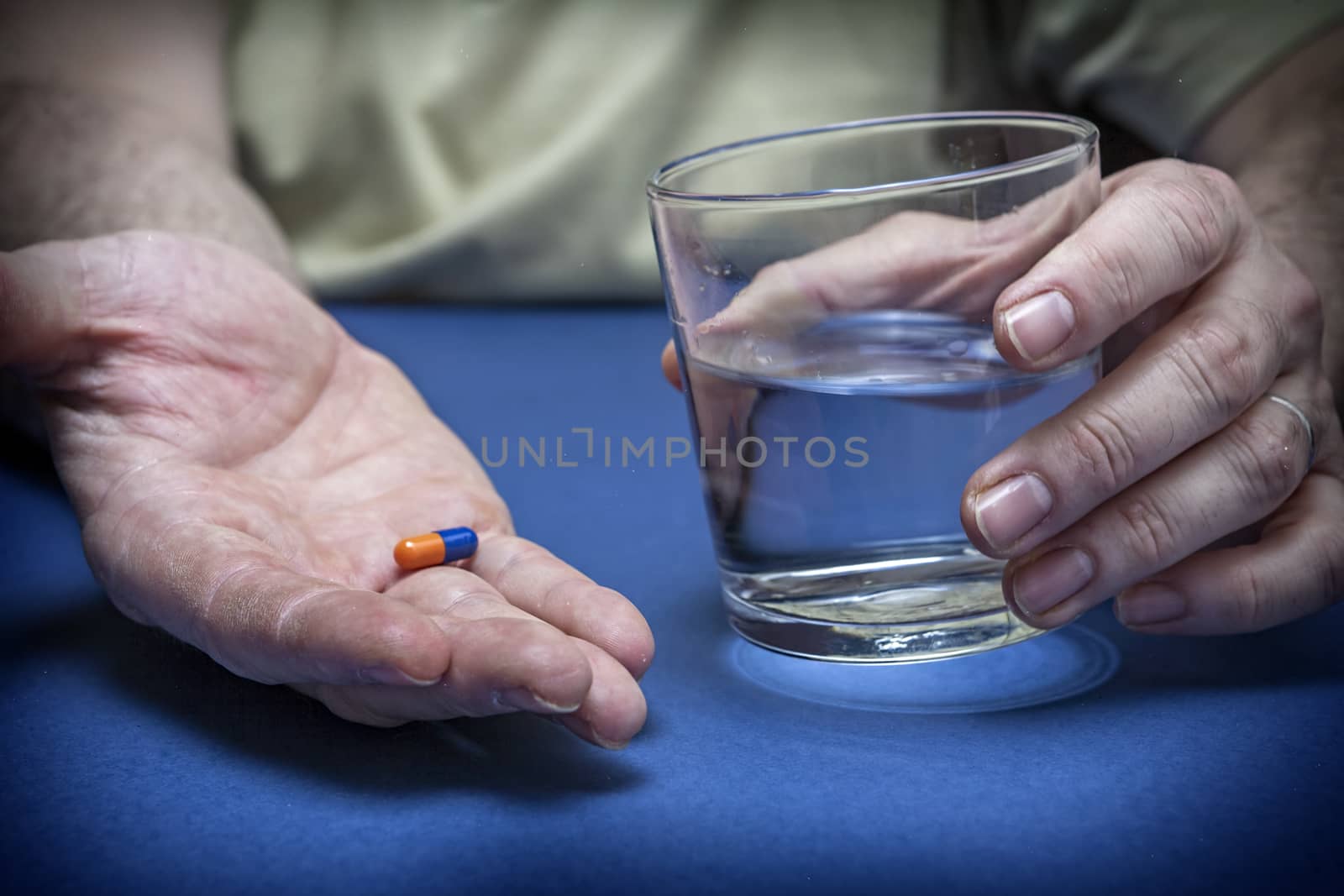 Close-up of a pill on male palm