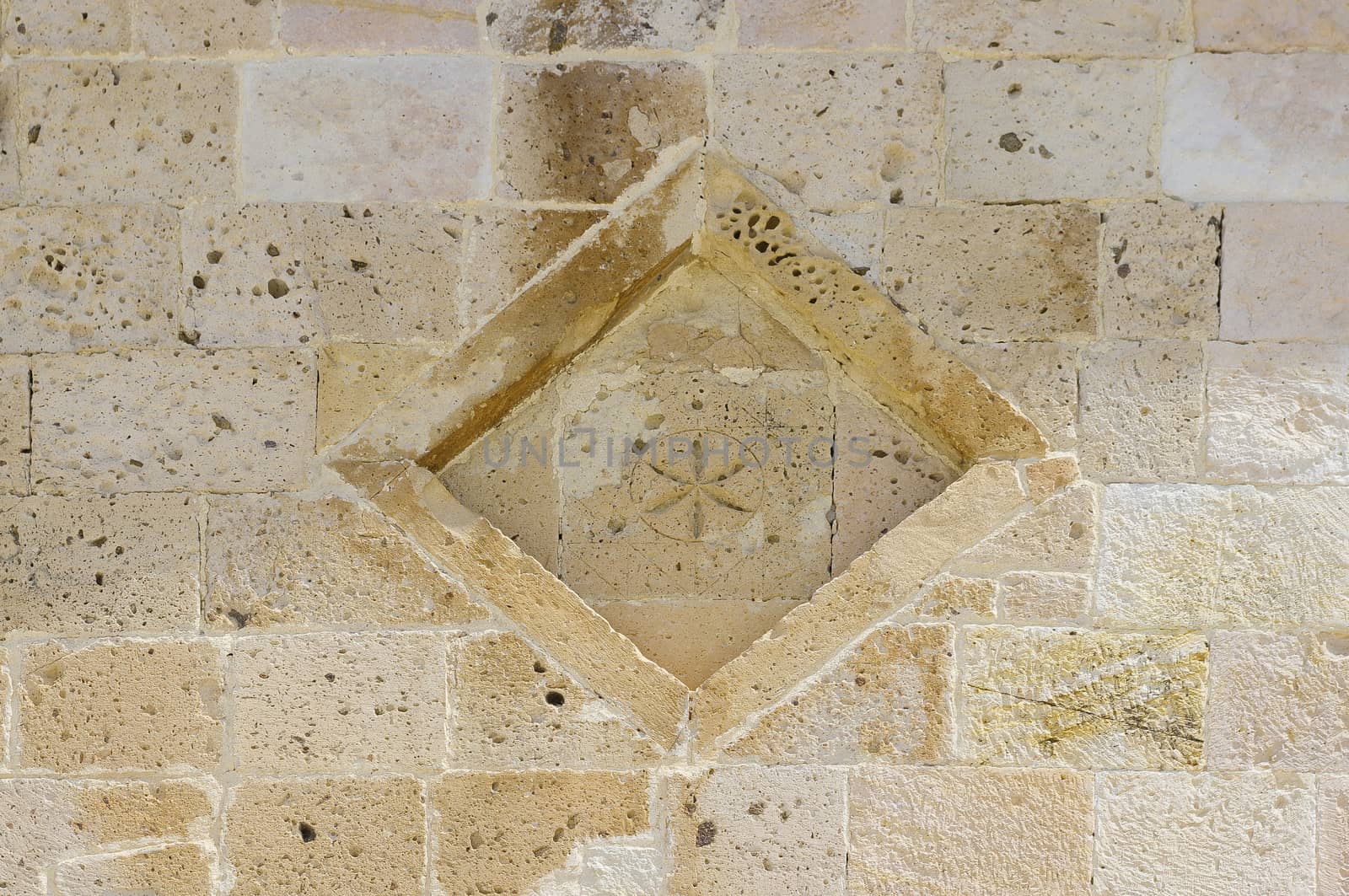 Decoration Romanesque church. Lozenge and cross six punnte