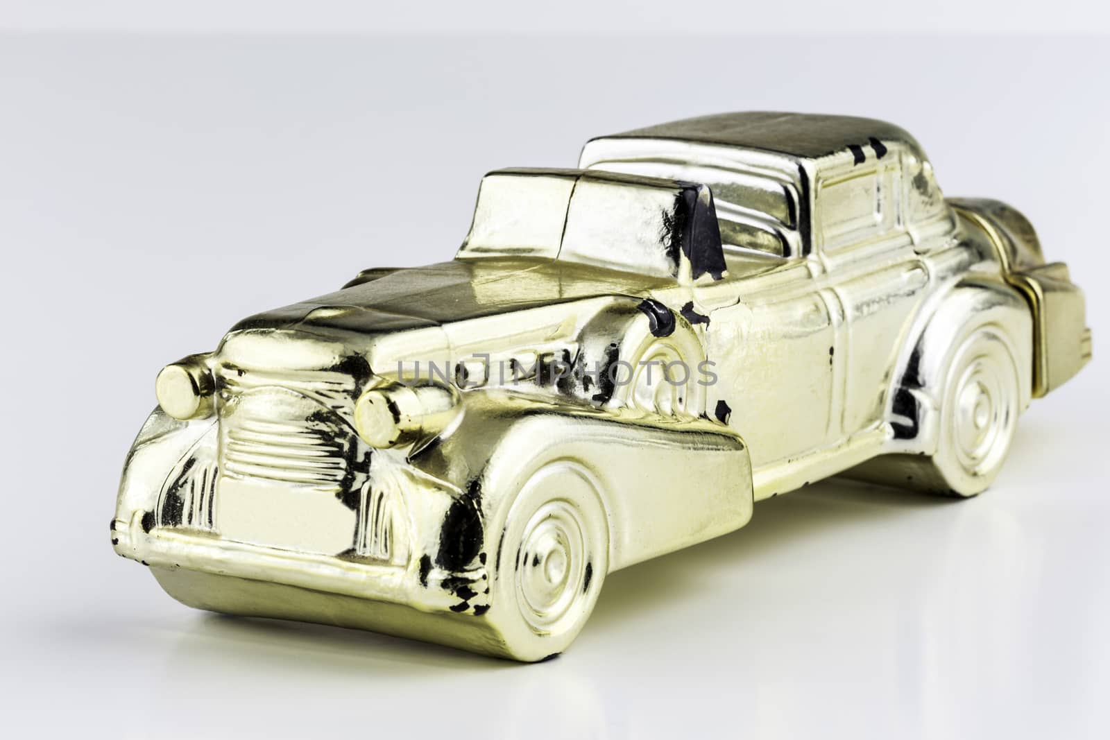 Golden collectable minature luxury car. 