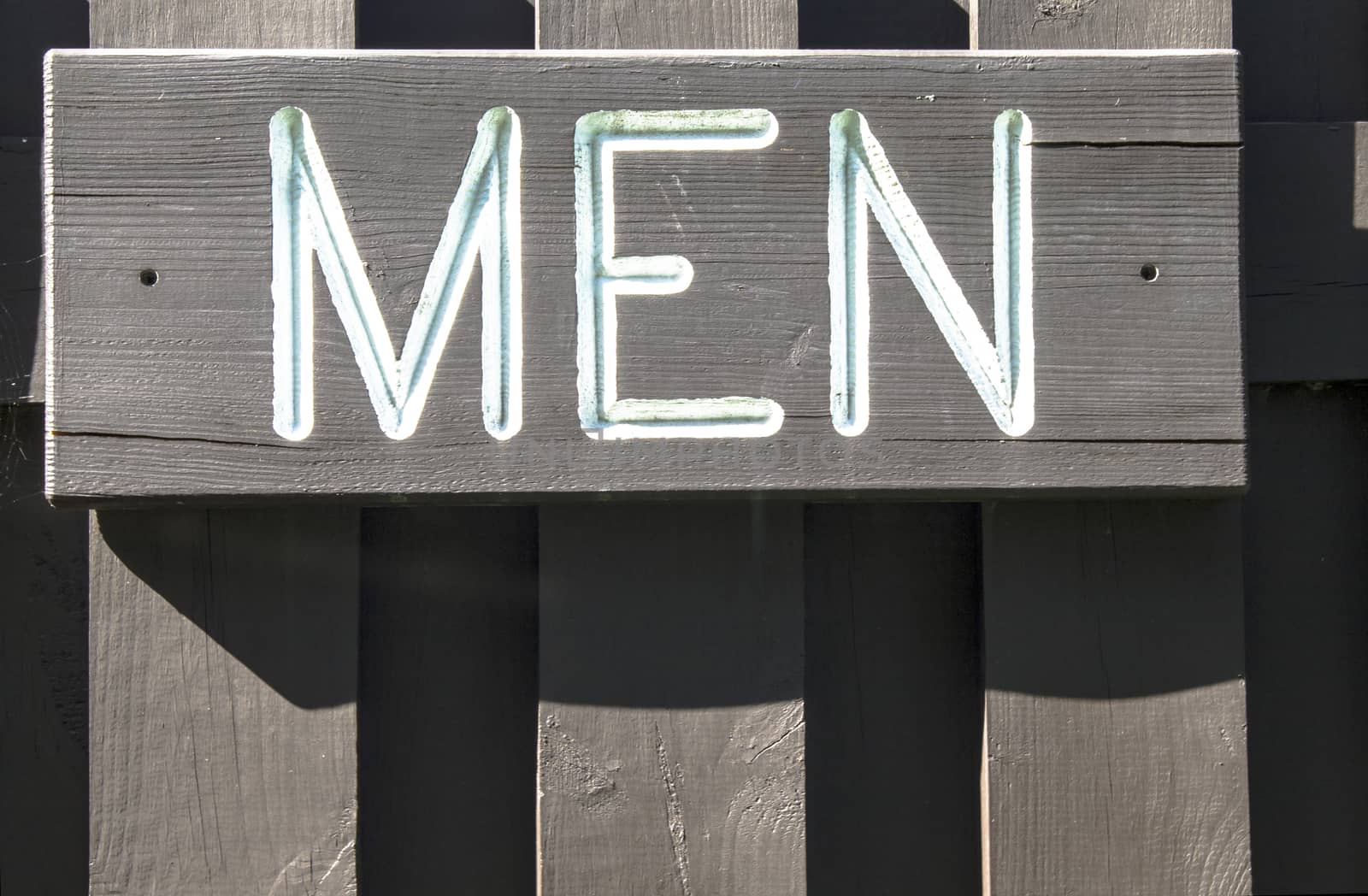 Wooden engraved mens room sign. 