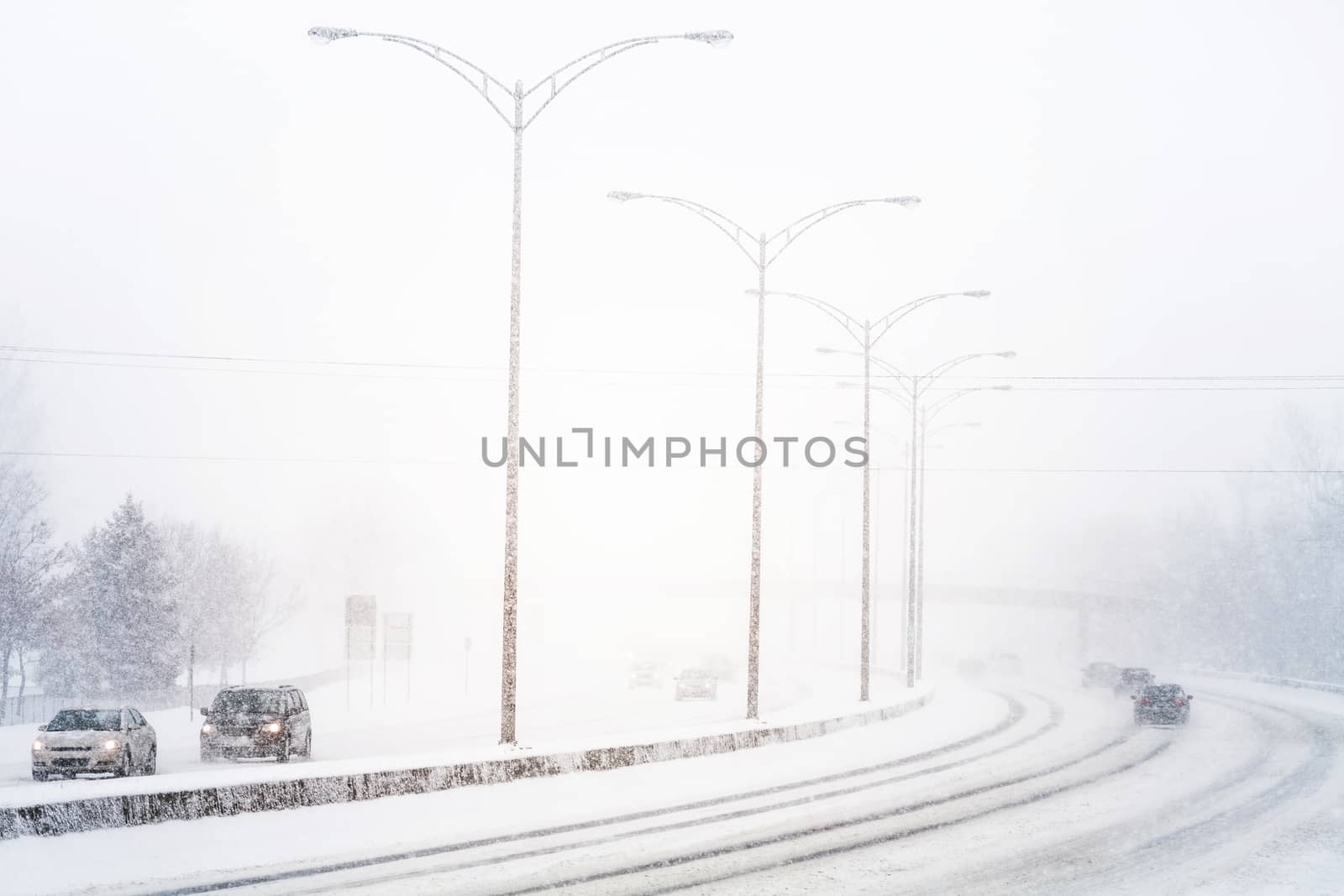 Disturbing Sunset Light and Snowstorm on Highway resulting of a Bad Visibility