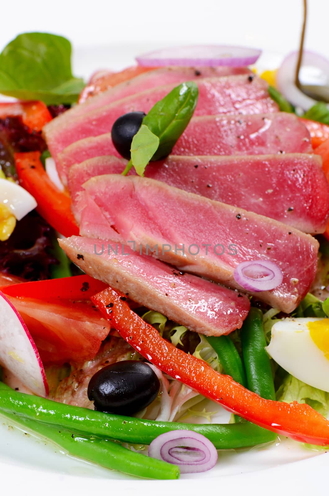 Nicoise with fresh tuna and vegetables close-up