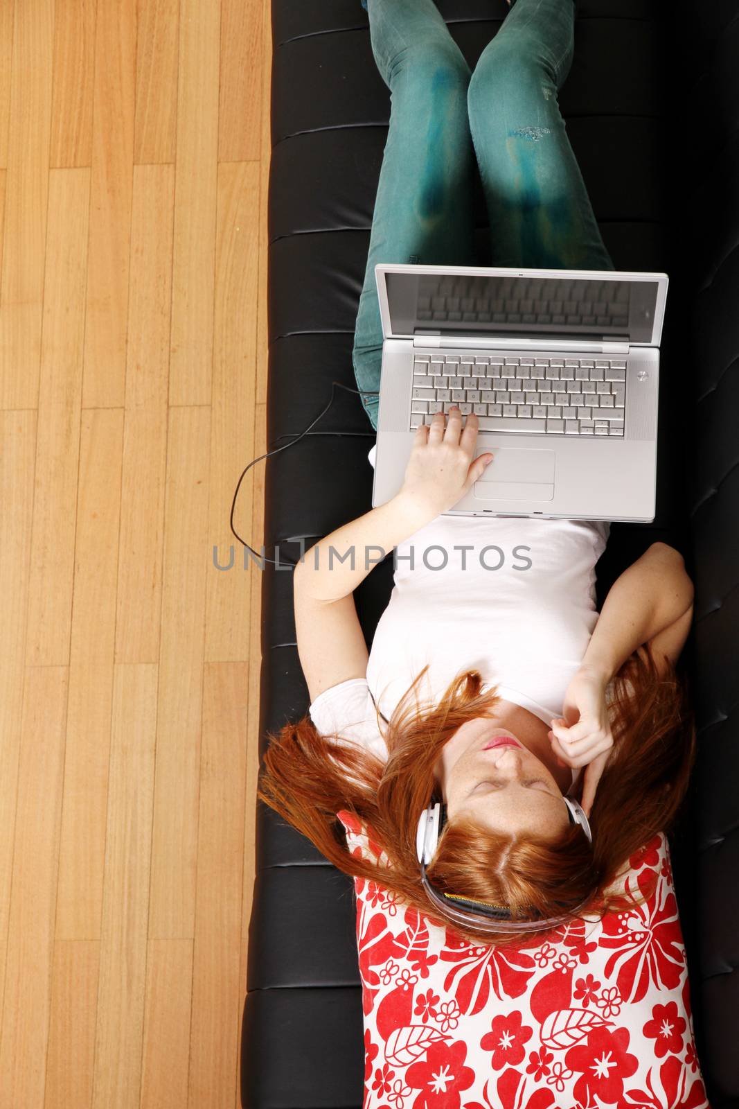 Young Redhead Girl surfing on the Sofa	 by Spectral