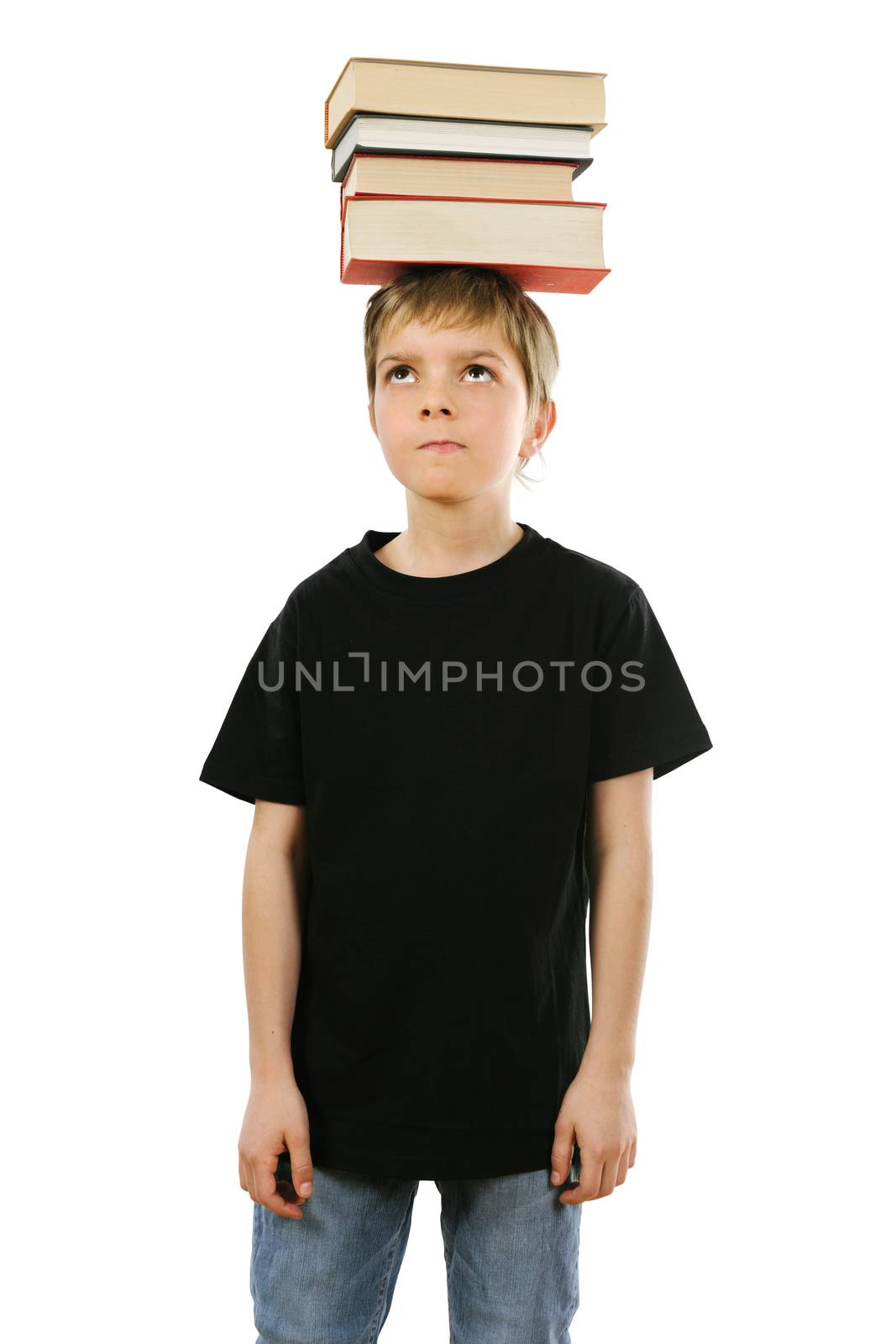 Boy balancing books on his head by sumners
