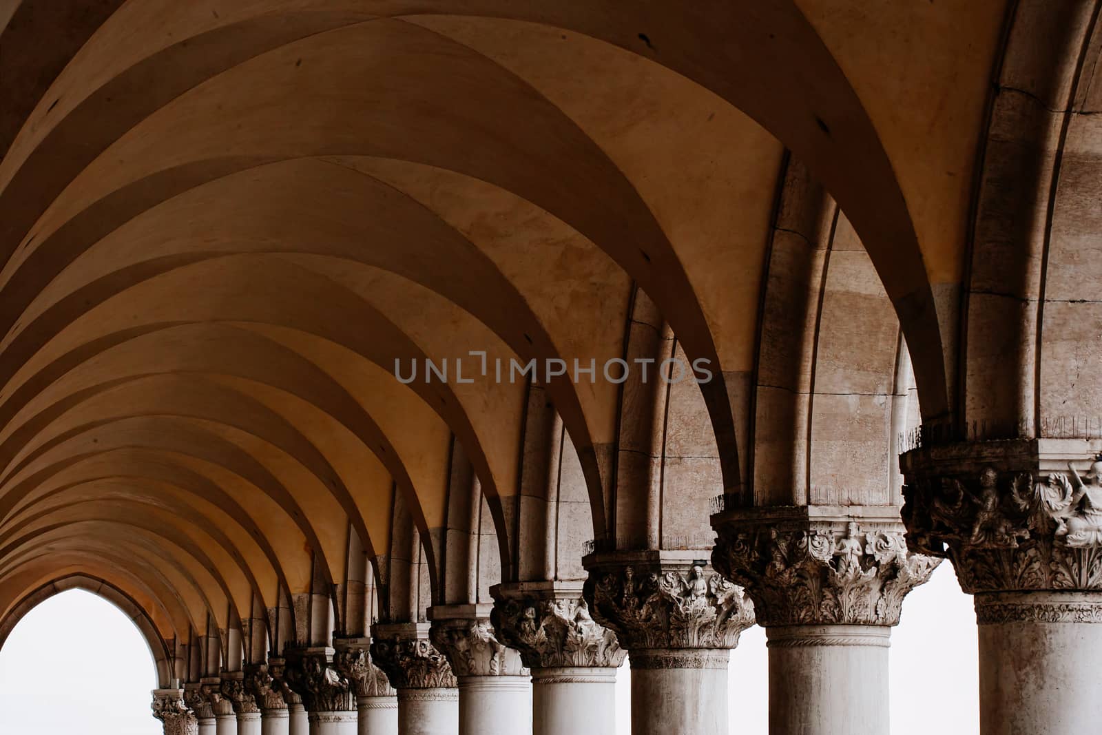 Photo of a row of arches and columns in Piazza San Marco in Venice Italy.