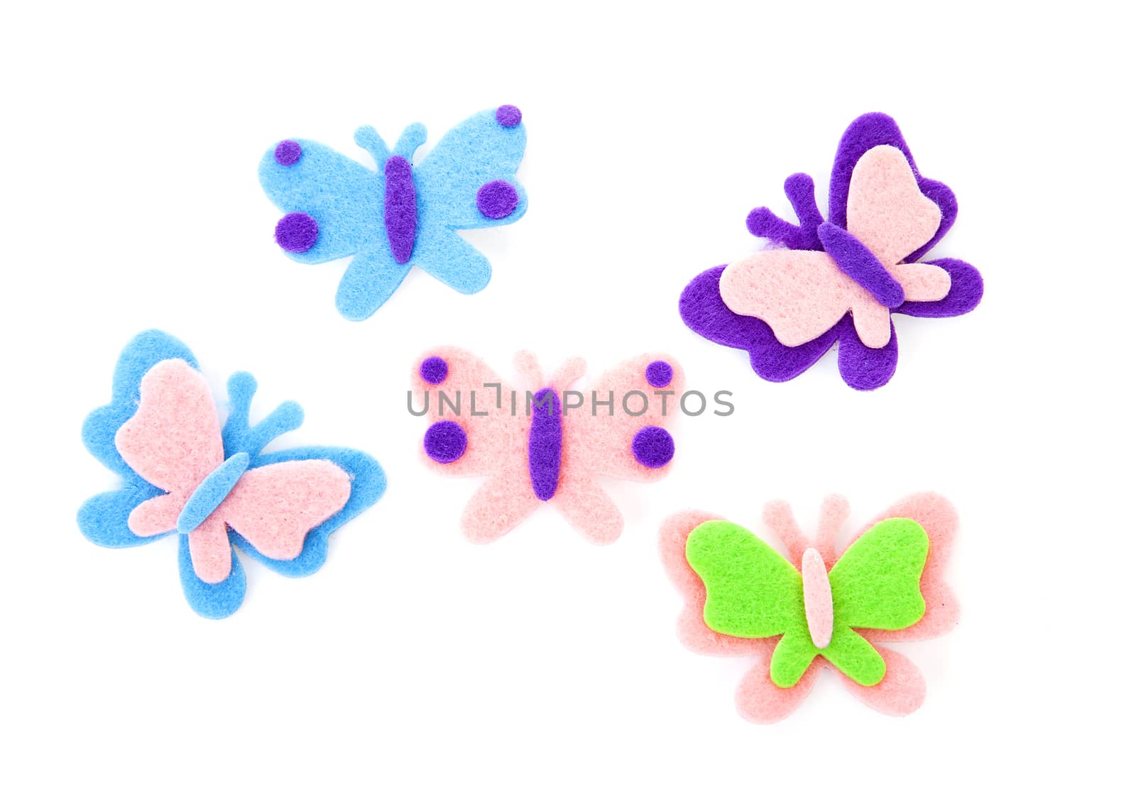 Five butterfly made of felt over white background