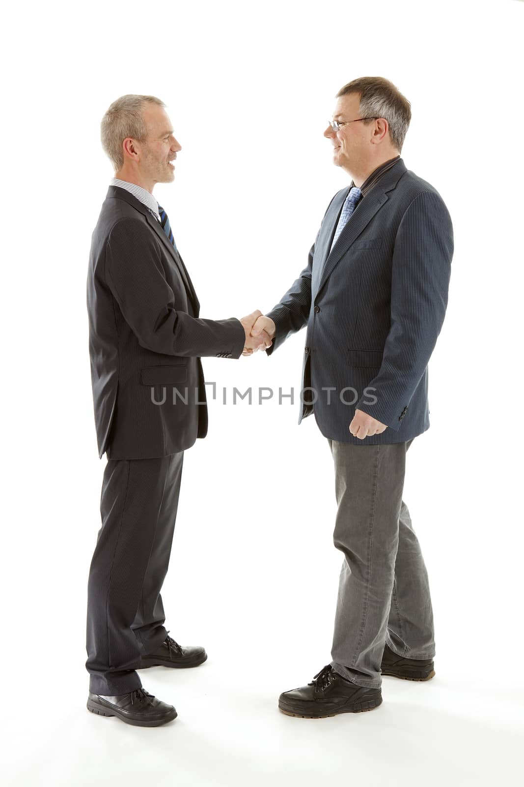 Business men shaking hands over white background