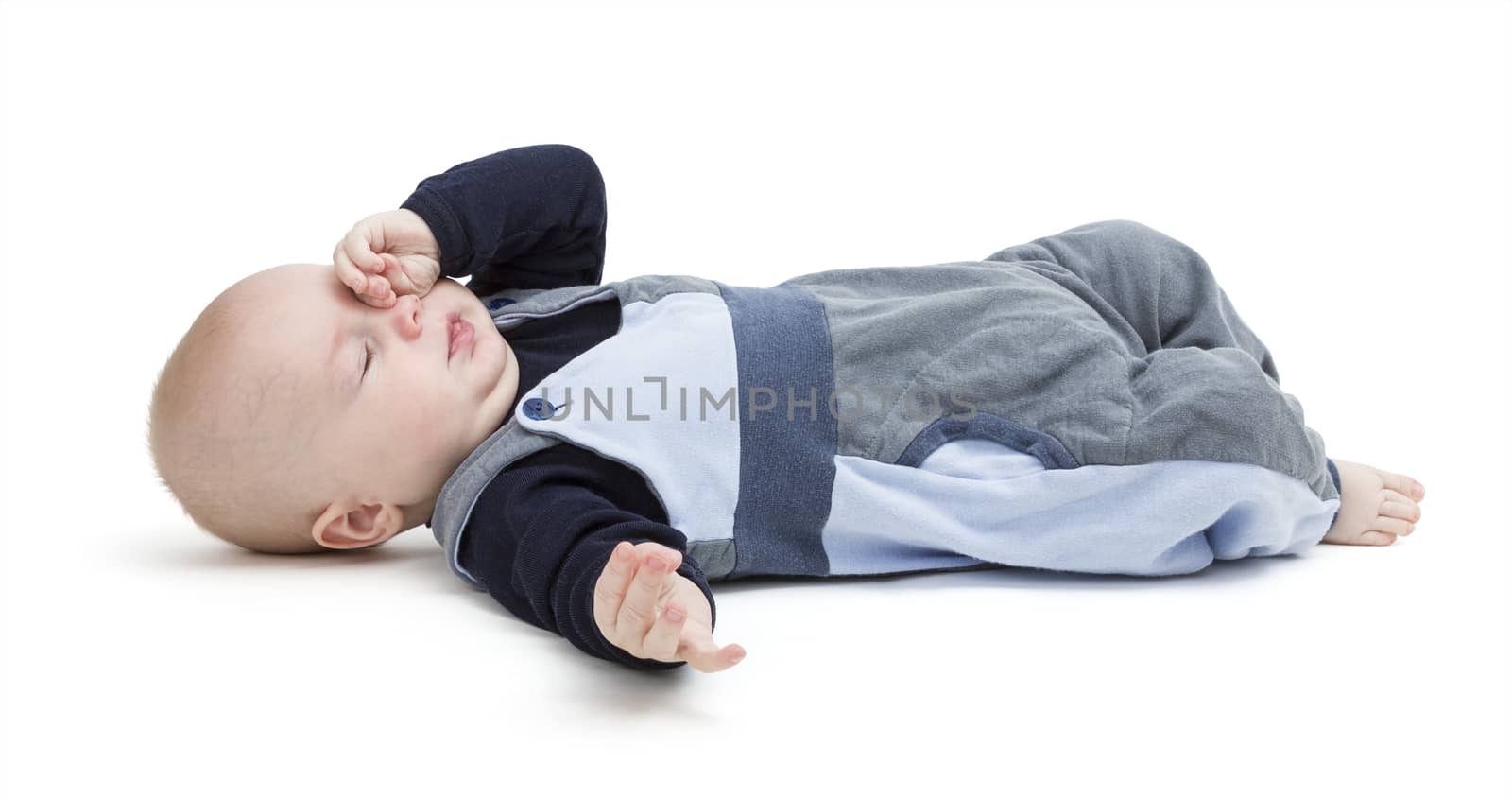 pooped baby isolated on white background. blue clothing. horizontal image