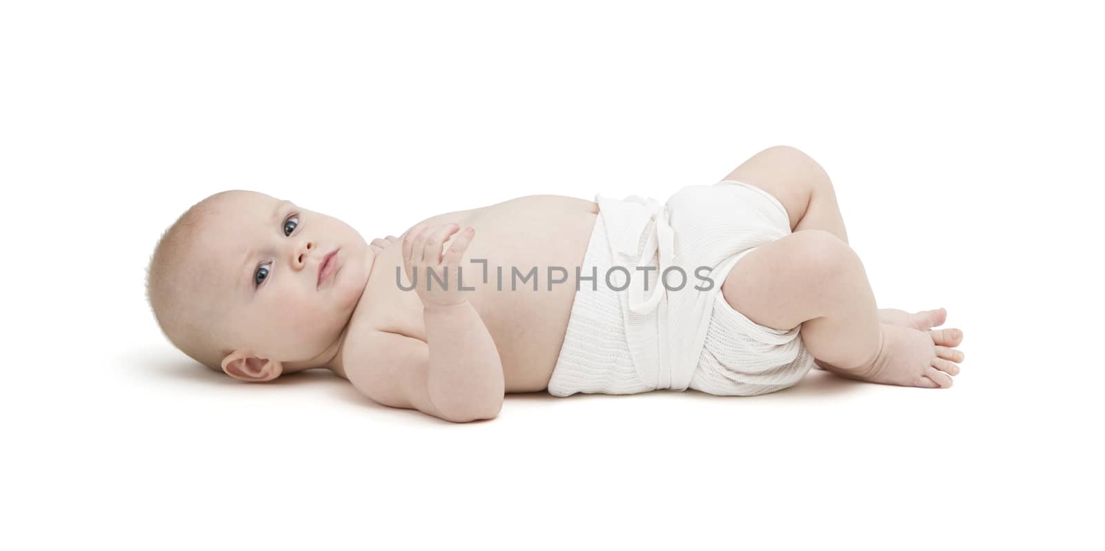 toddler in diaper lying on back. isolated on white background