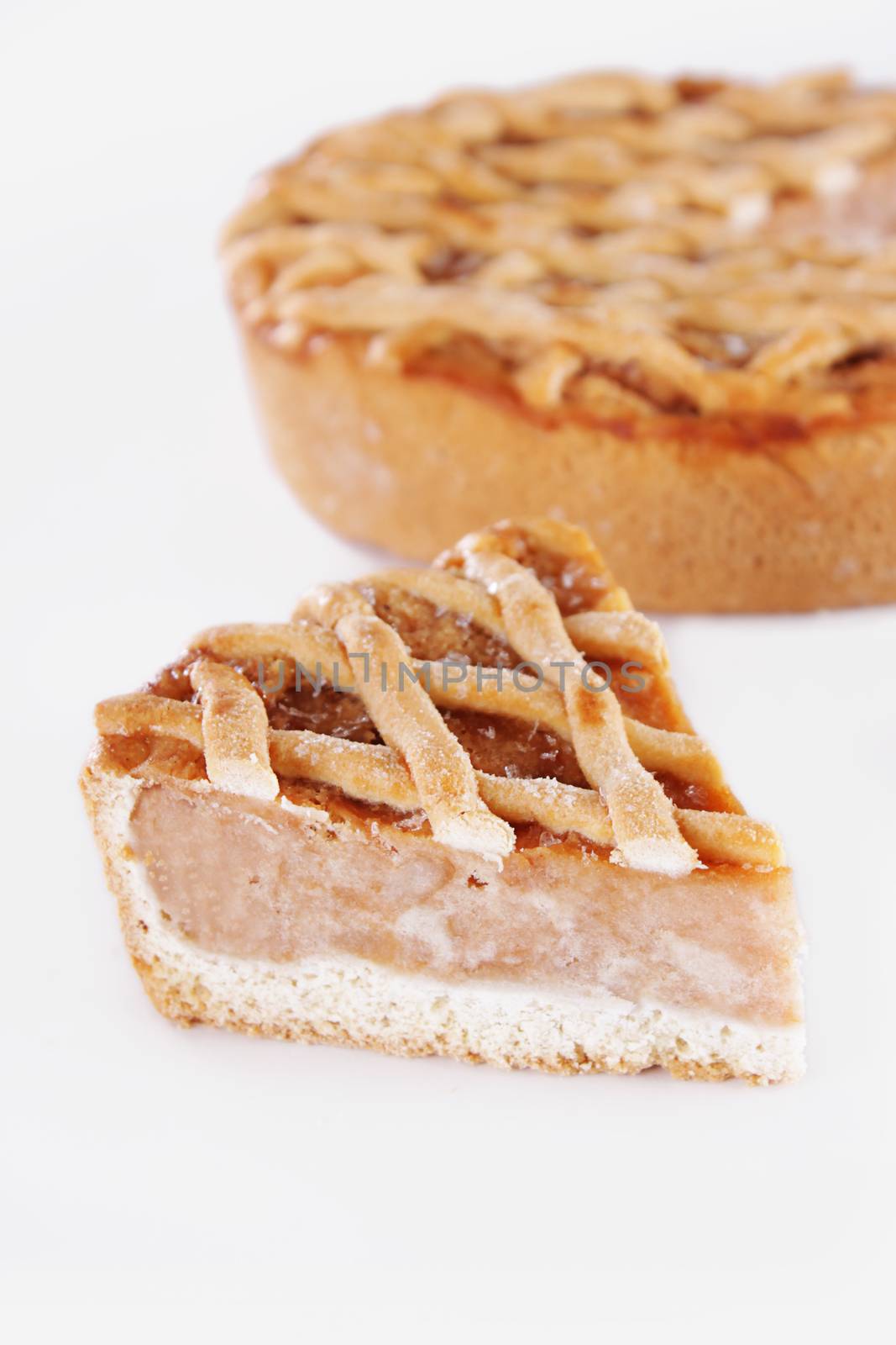 Piece of traditional apple pie isolated on white