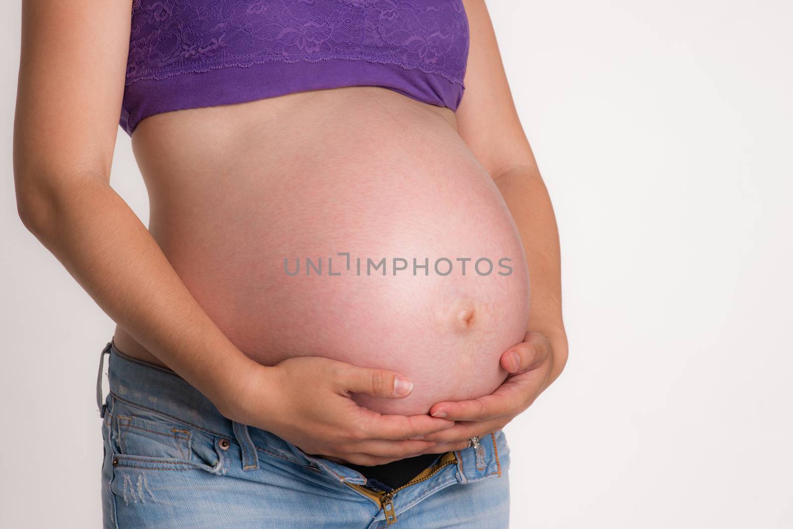 Pregnant Woman Expecting Baby Torso Standing Hands on Belly by ChrisBoswell