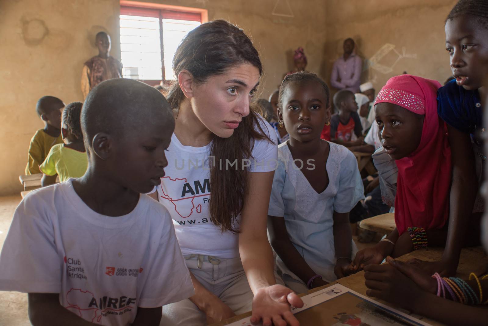 MATAM,SENEGAL-CIRCA NOVEMBER 2013:Actress Caterina Murino greets the children of an elementary school,Caterina Murino is the testimonial of the NGO AMREF,circa November 2013.