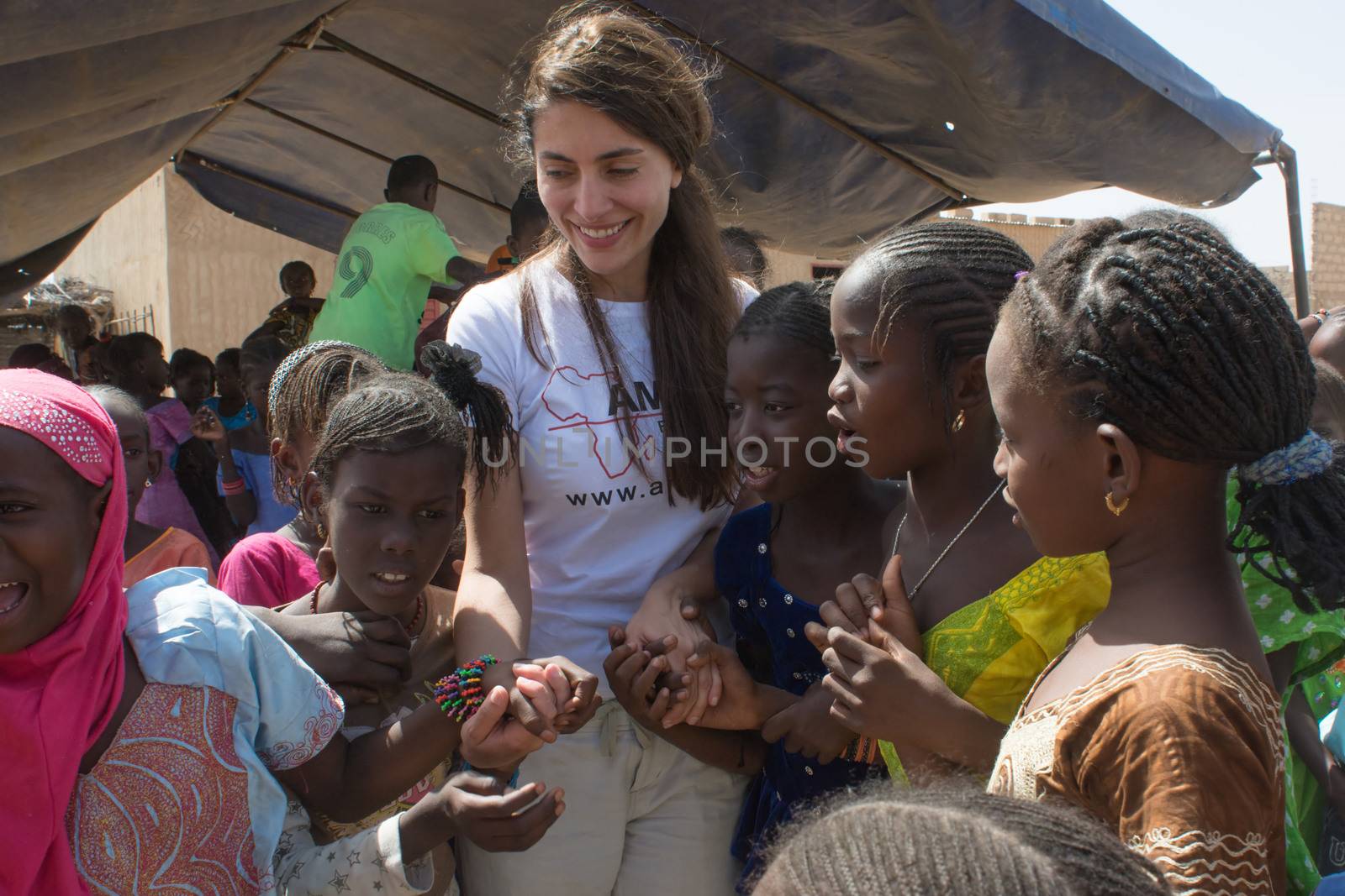 MATAM,SENEGAL-CIRCA NOVEMBER 2013:Actress Caterina Murino greets the children of an elementary school,Caterina Murino is the testimonial of the NGO AMREF,circa November 2013.