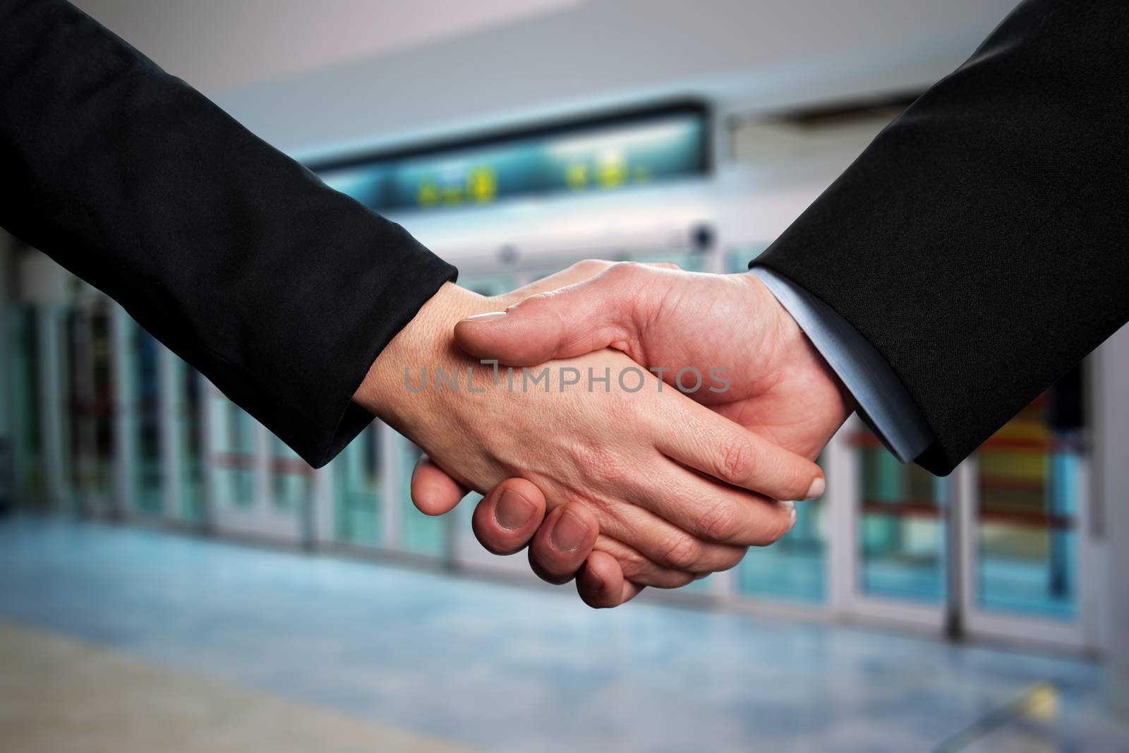 Symbol of agreement, business handshake by stockyimages