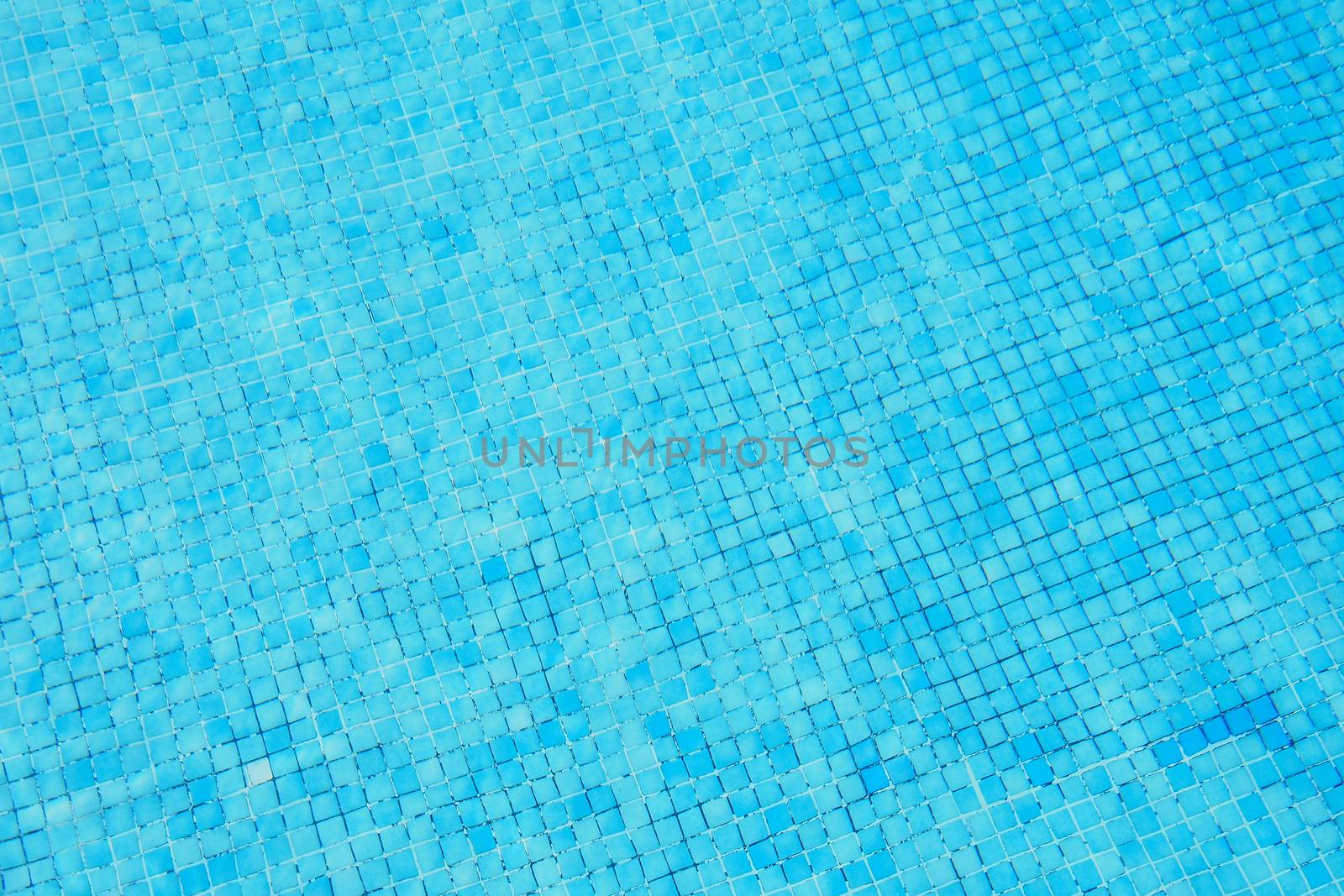 Blue ripped water in swimming pool by stockyimages