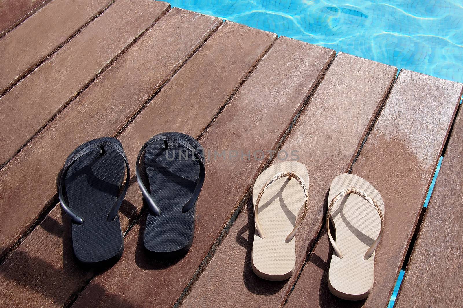 Flip flops at swimming pool from the family
