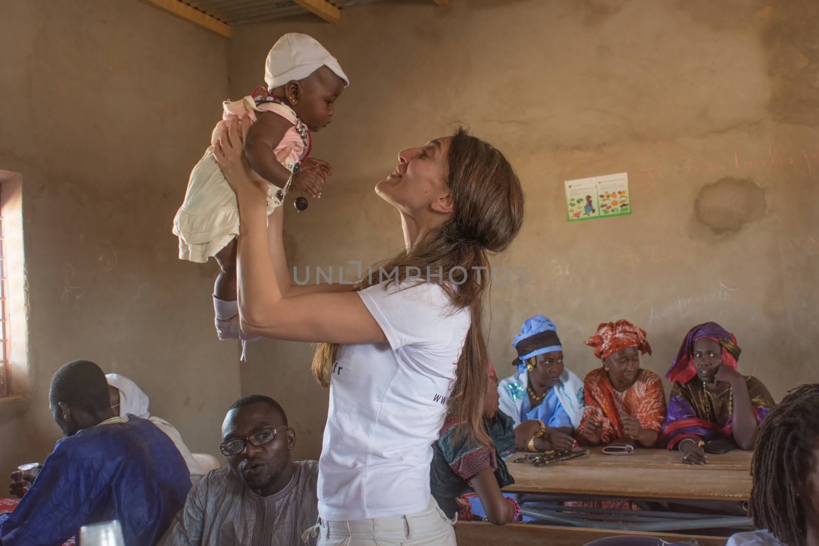 MATAM,SENEGAL-CIRCA NOVEMBER 2013:Caterina Murino plays with an African child,Caterina Murino is the testimonial of the NGO AMREF,circa November 2013.