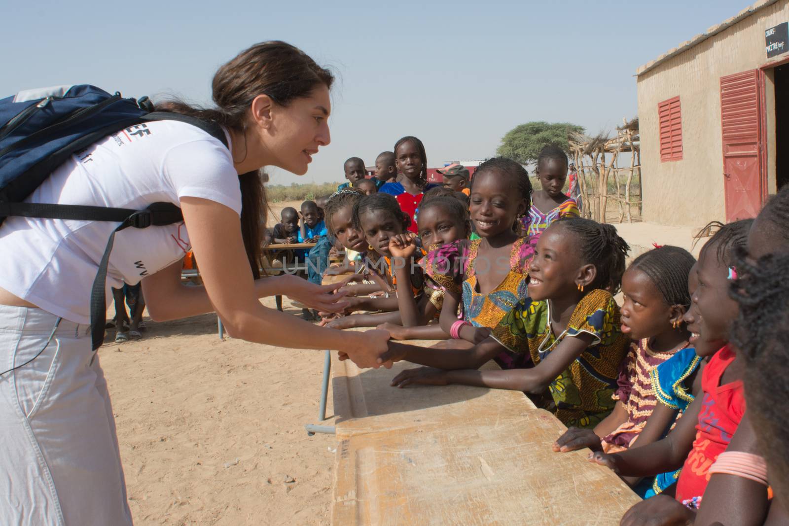 MATAM,SENEGAL-CIRCA NOVEMBER 2013:Actress Caterina Murino greets the children of an elementary school,Caterina Murino is the testimonial of the NGO AMREF,circa November 2013.