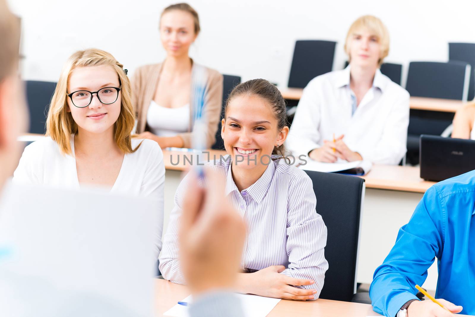 image of a students listen attentively to the teacher