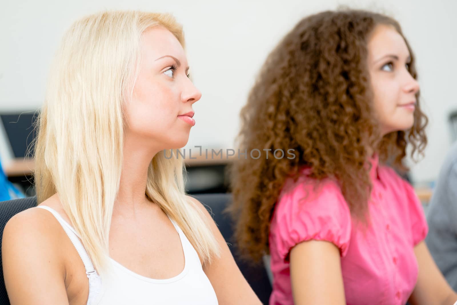 portrait of young female students in the classroom, teaching at the University of