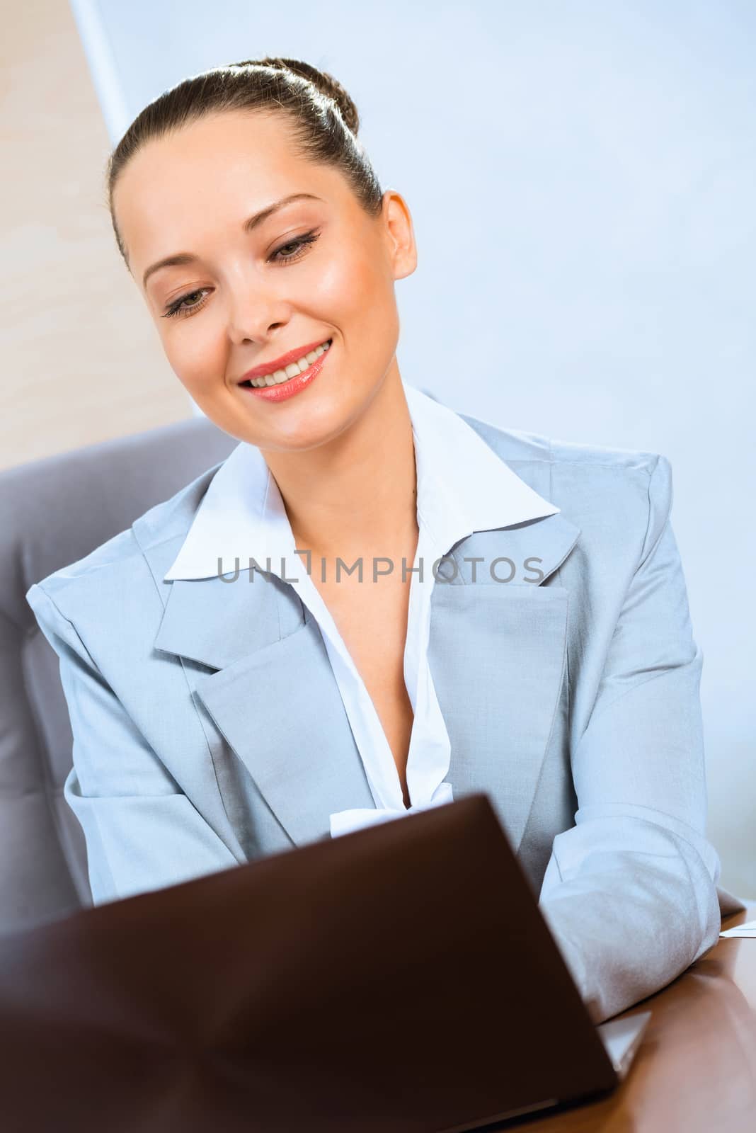 image of a successful business woman, working with laptop