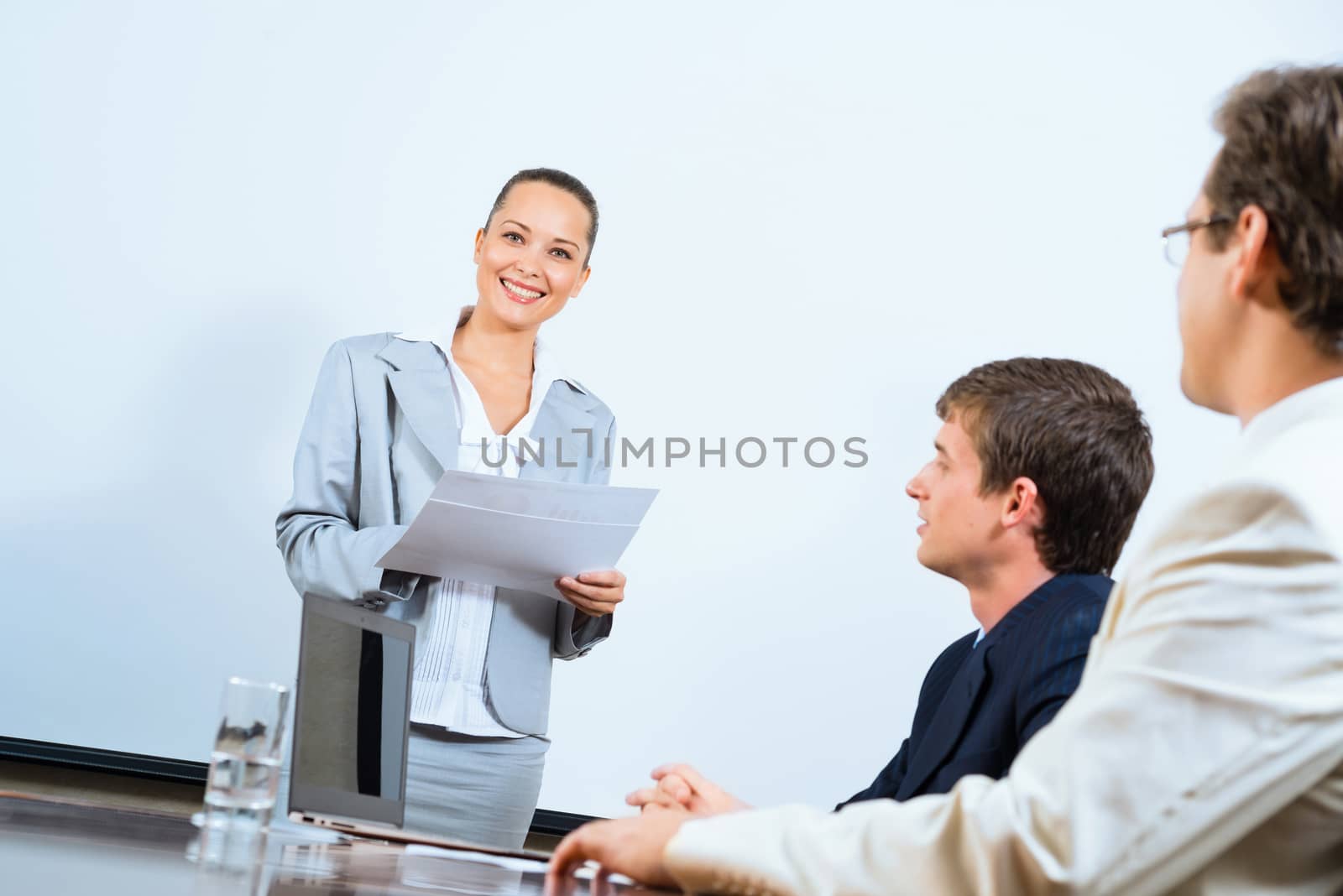 image of a discusses business woman with colleagues