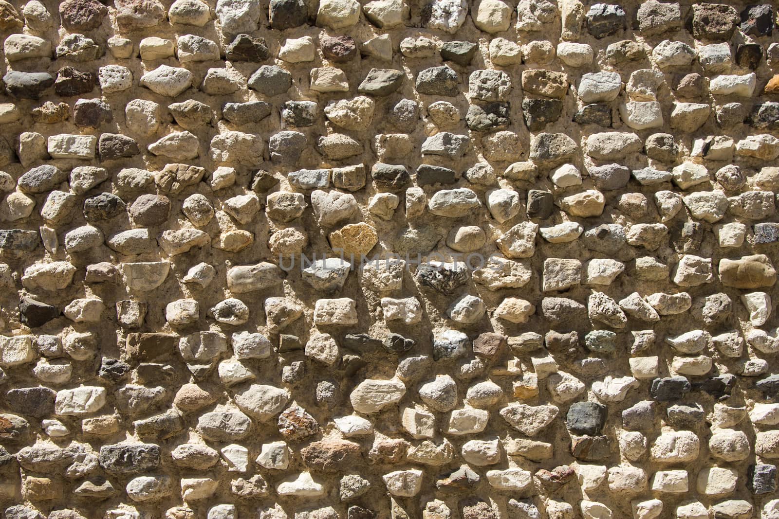 Rough, highly textured old stone block wall from Greece by huntz