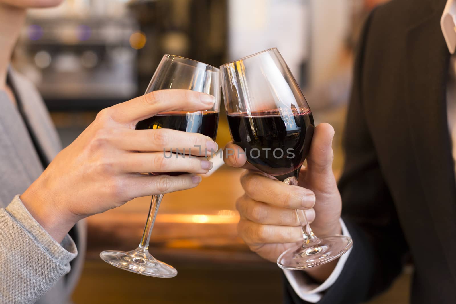 male female cheers alcohol bar