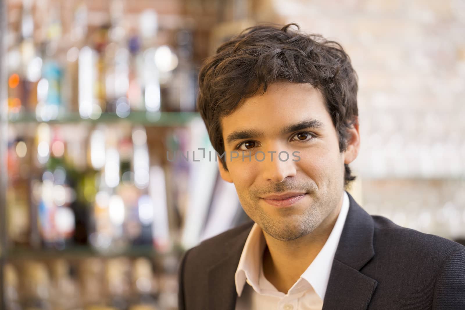 Portrait of handsome man in restaurant by LDProd