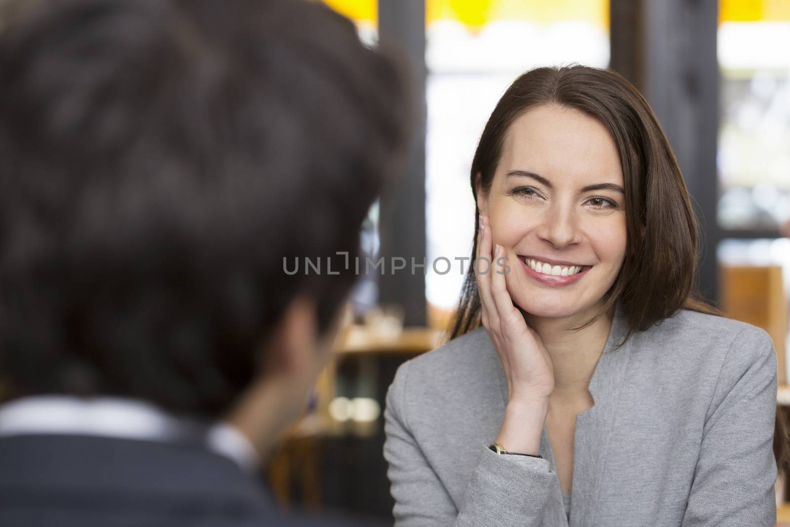 Portrait of beautiful woman during a lunch with a man in restaur by LDProd