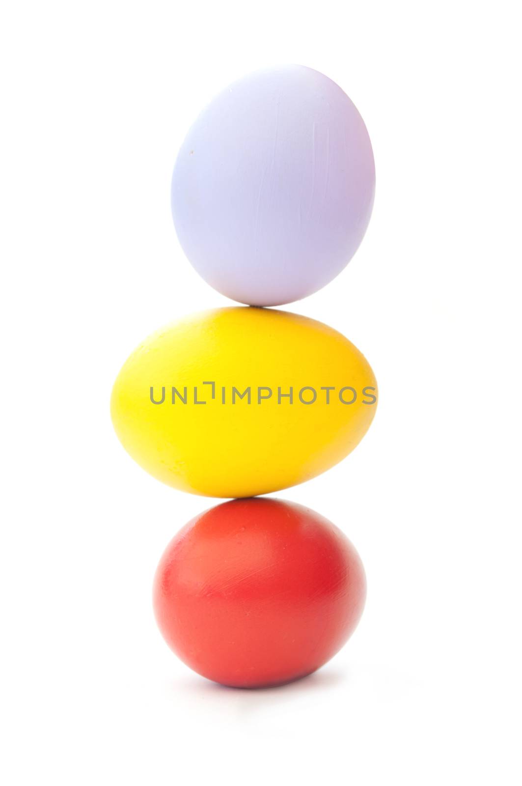 Painted easter eggs stacked on top of each other