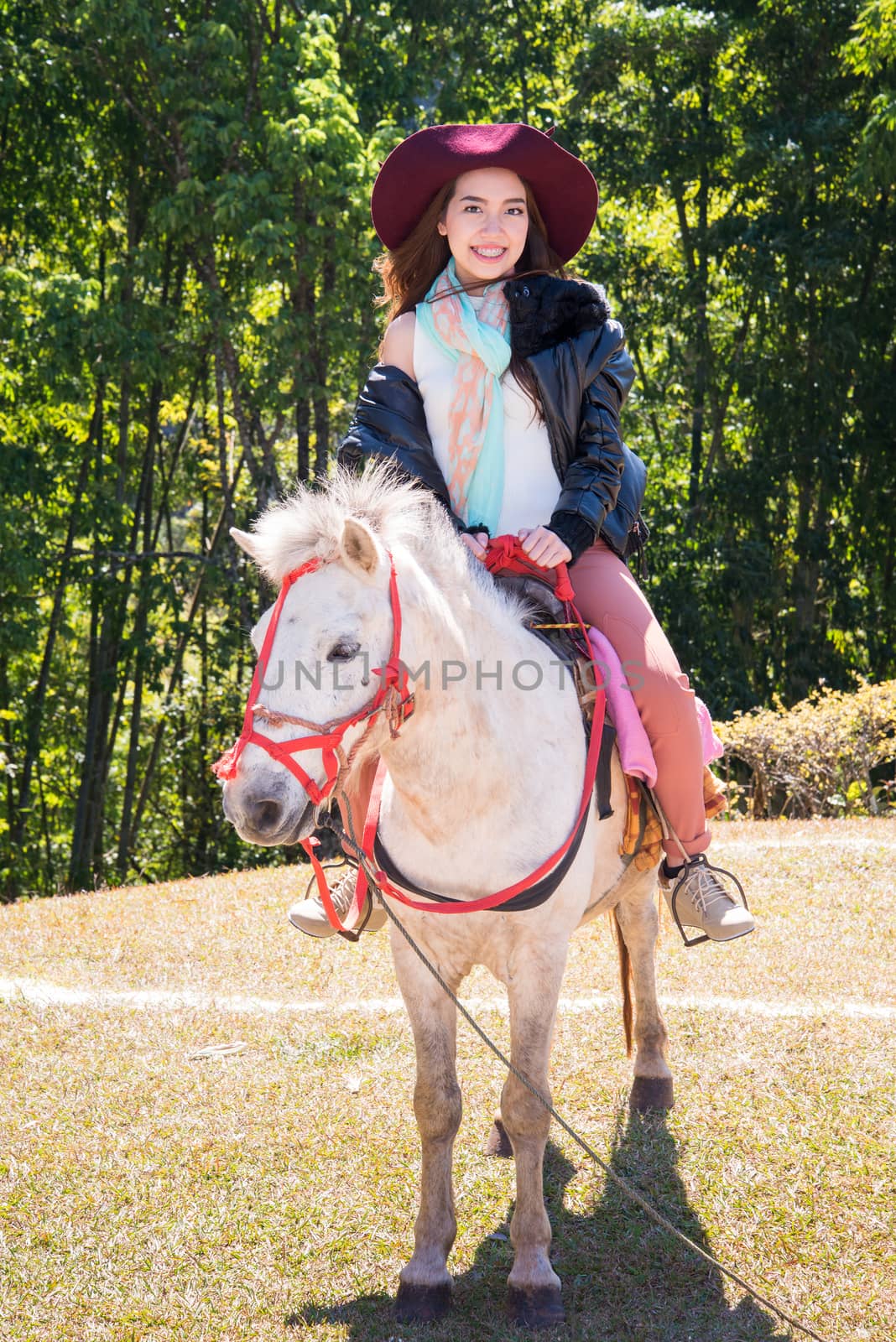 Asia women on horseback