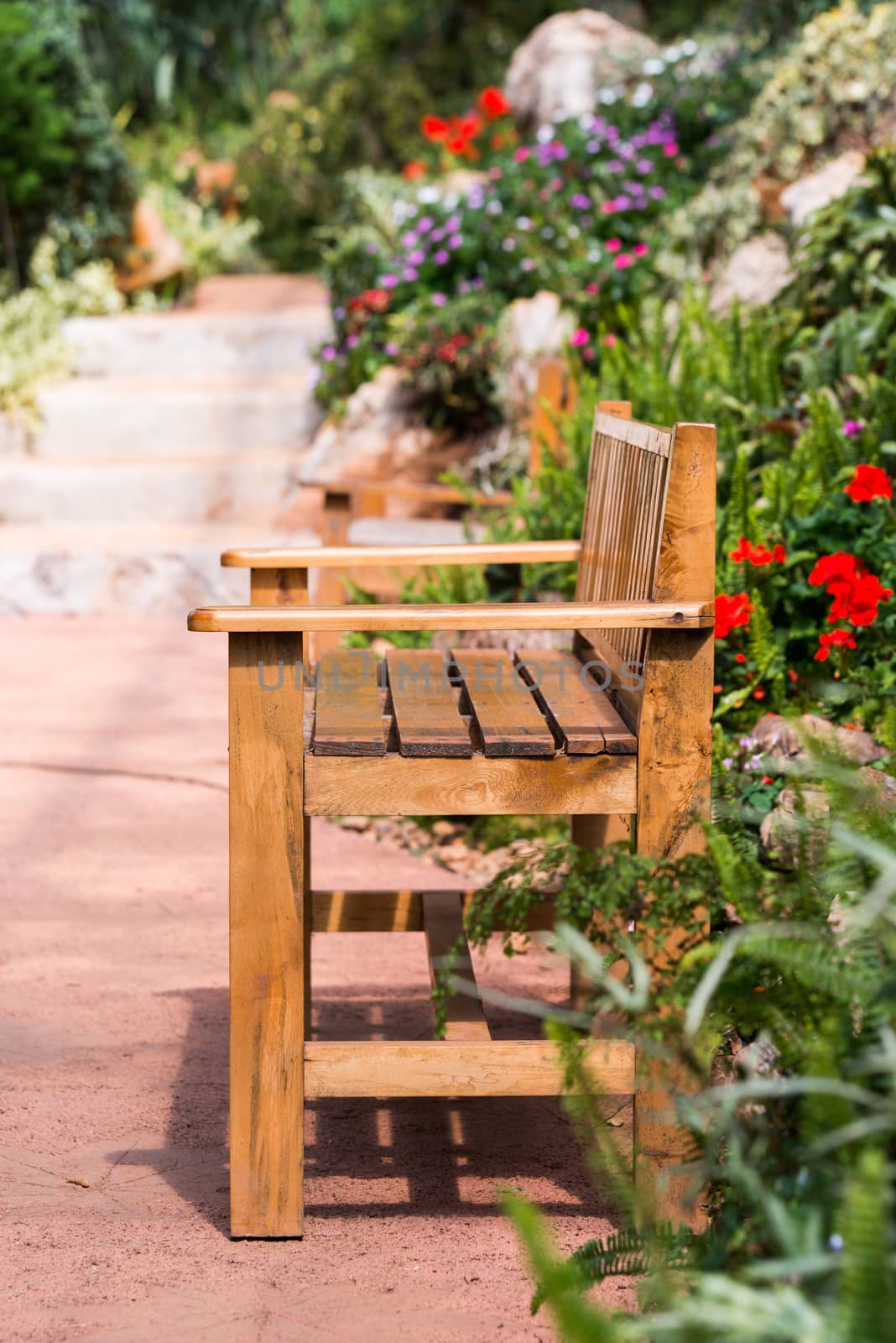 Lonely bench in the park by jakgree