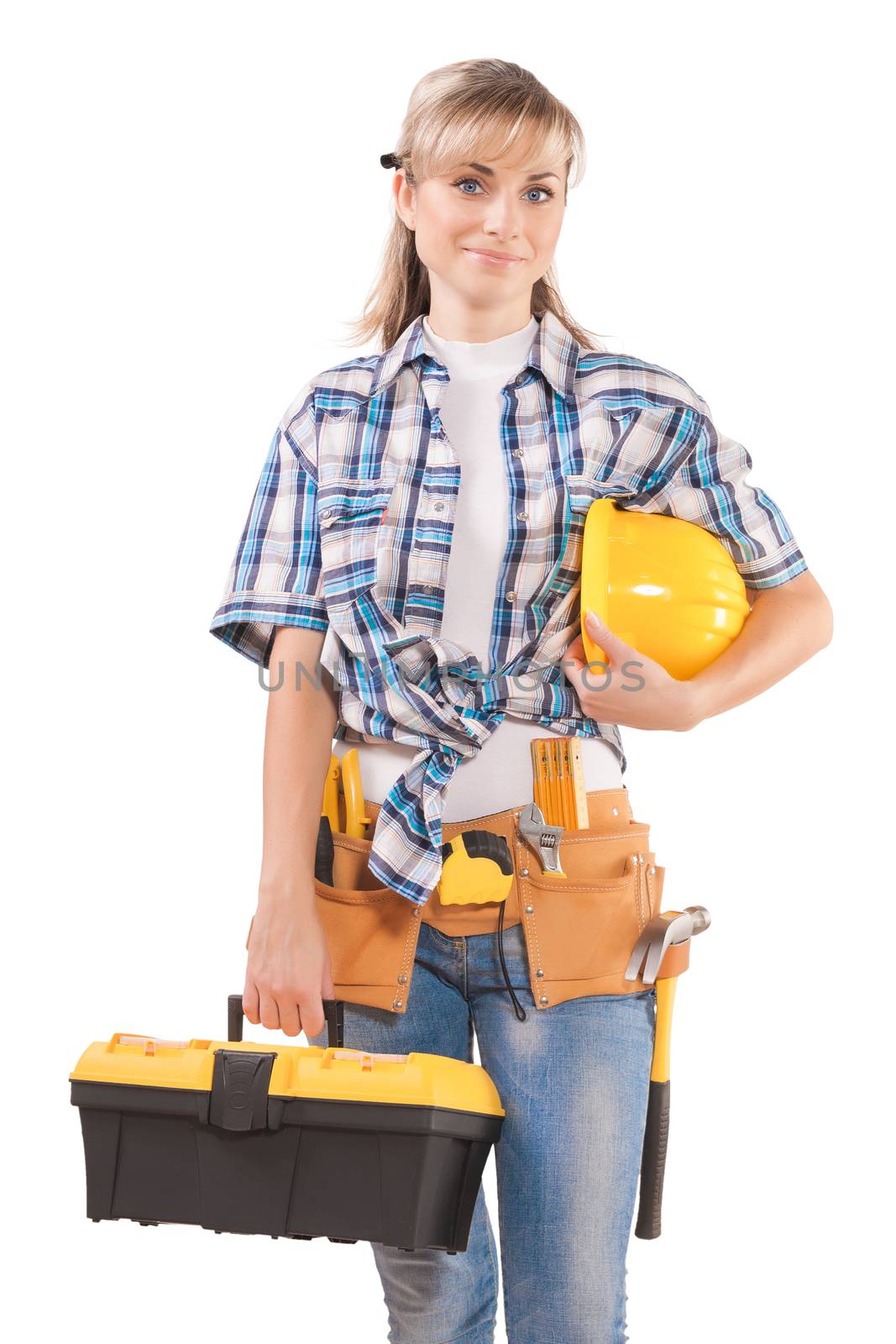 female wearing working clothes with toolbelt holding hardhat and by mihalec