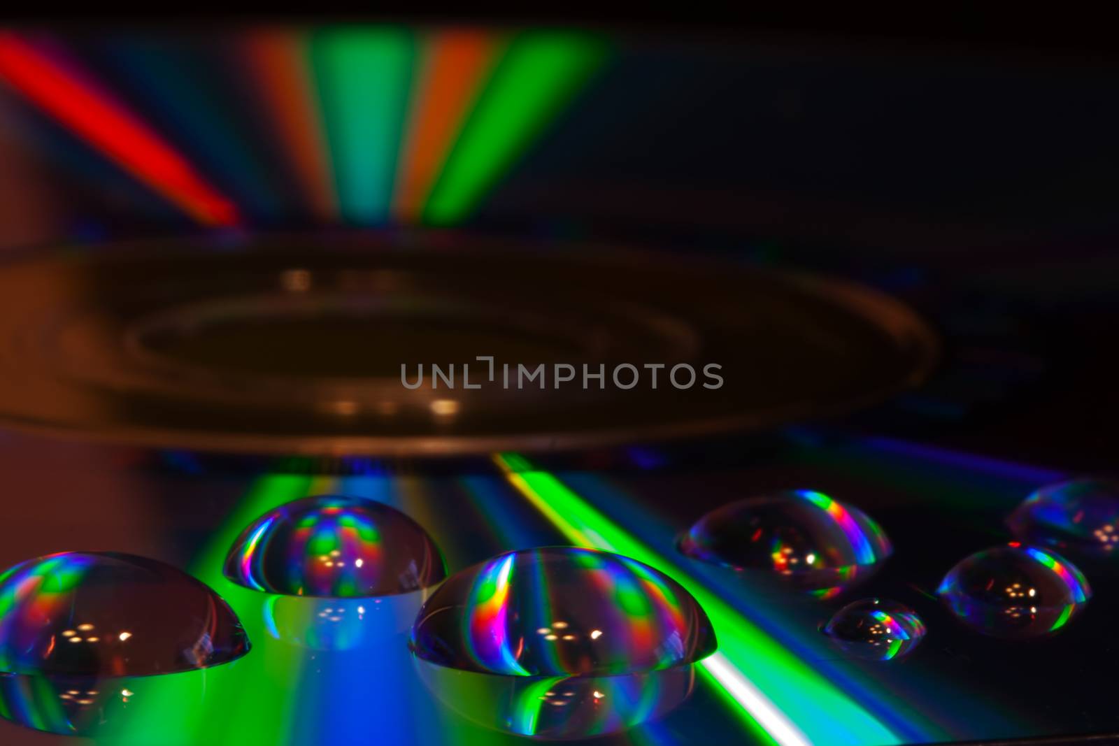 Colorful water drops on CD/DVD disc  by Coffee999