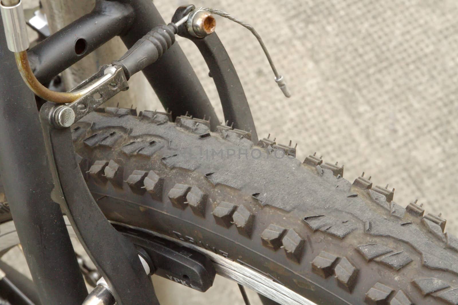 Close up on worn bicycle tire in the city