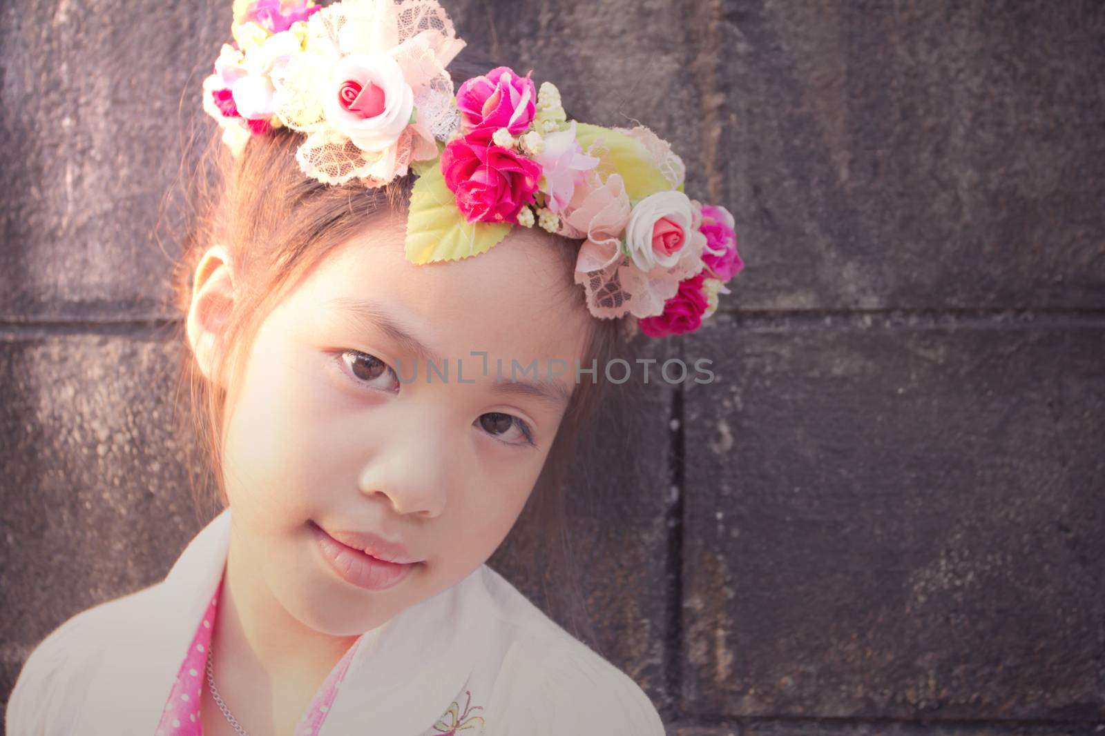 Lovely little girl with flowers on the head by wyoosumran