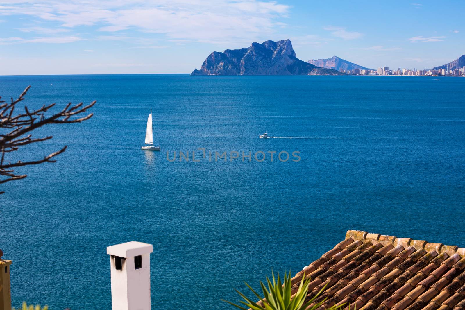 Ifach Penon view of calpe and Sailboat from Moraira in Mediterranean Alicante at Spain