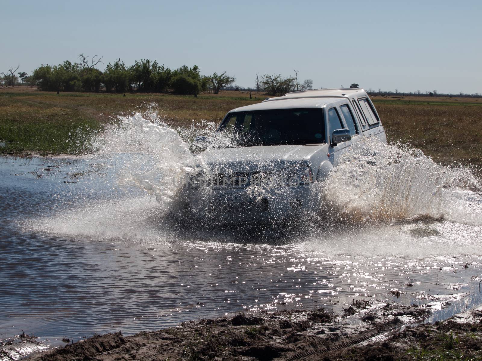 Car passing the ford (Savuti Marsh, Chobe National Park, Botswana)
