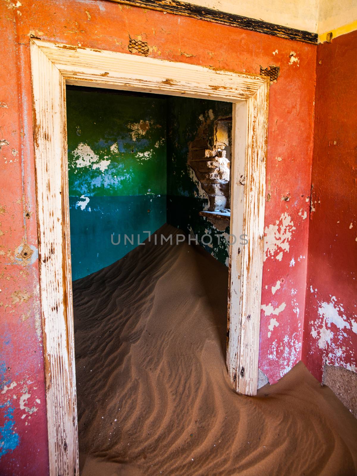 Sand in abandoned house in Kolmanskop ghost town (Namibia)