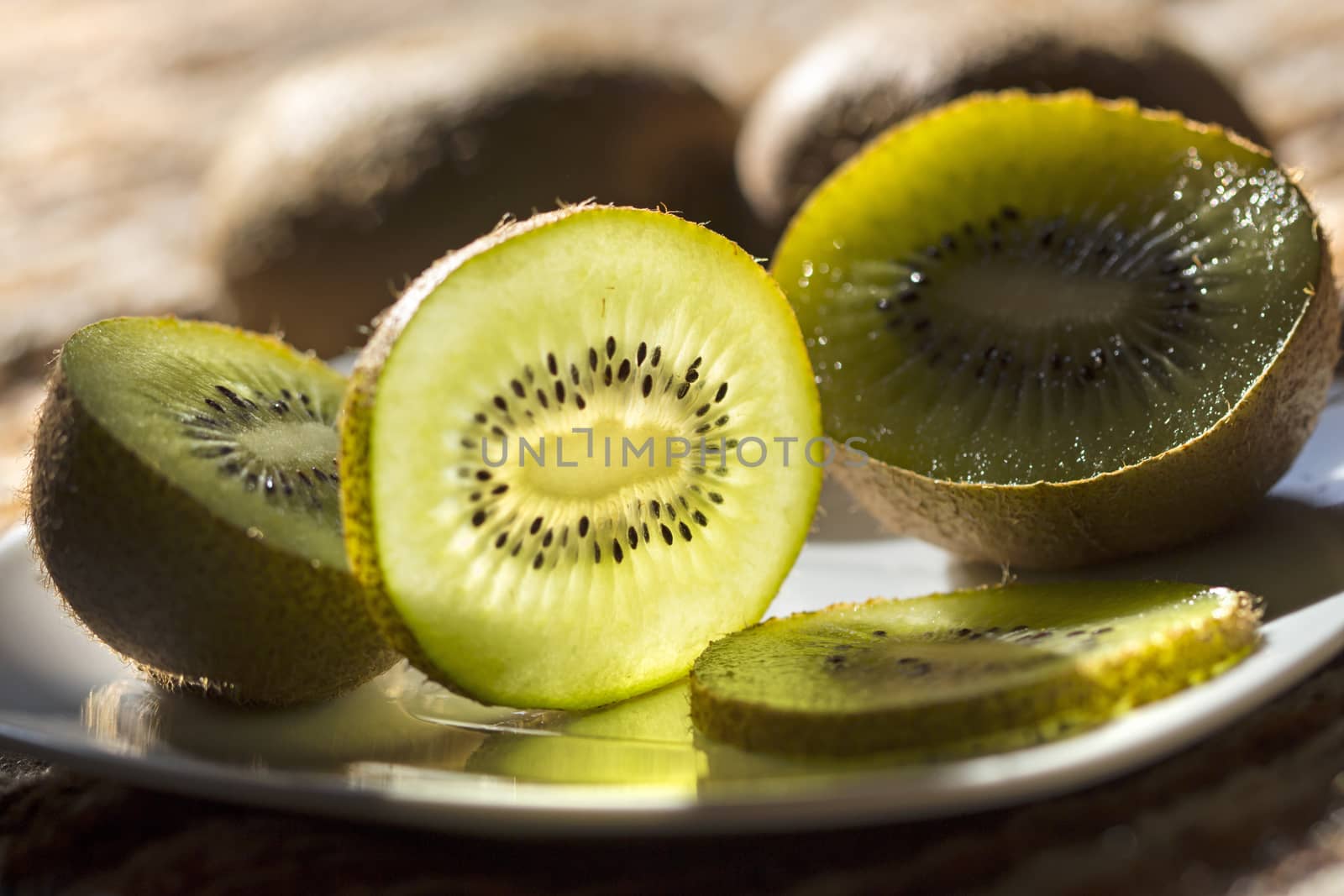 juicy kiwi halves and slices on a plate