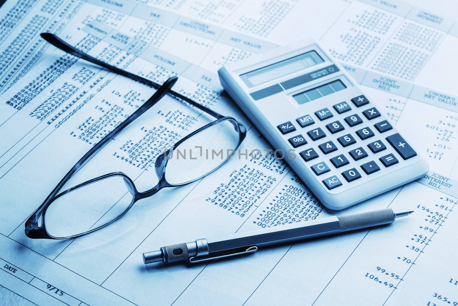 accounting work space with calculator,pen and profit and loss statements