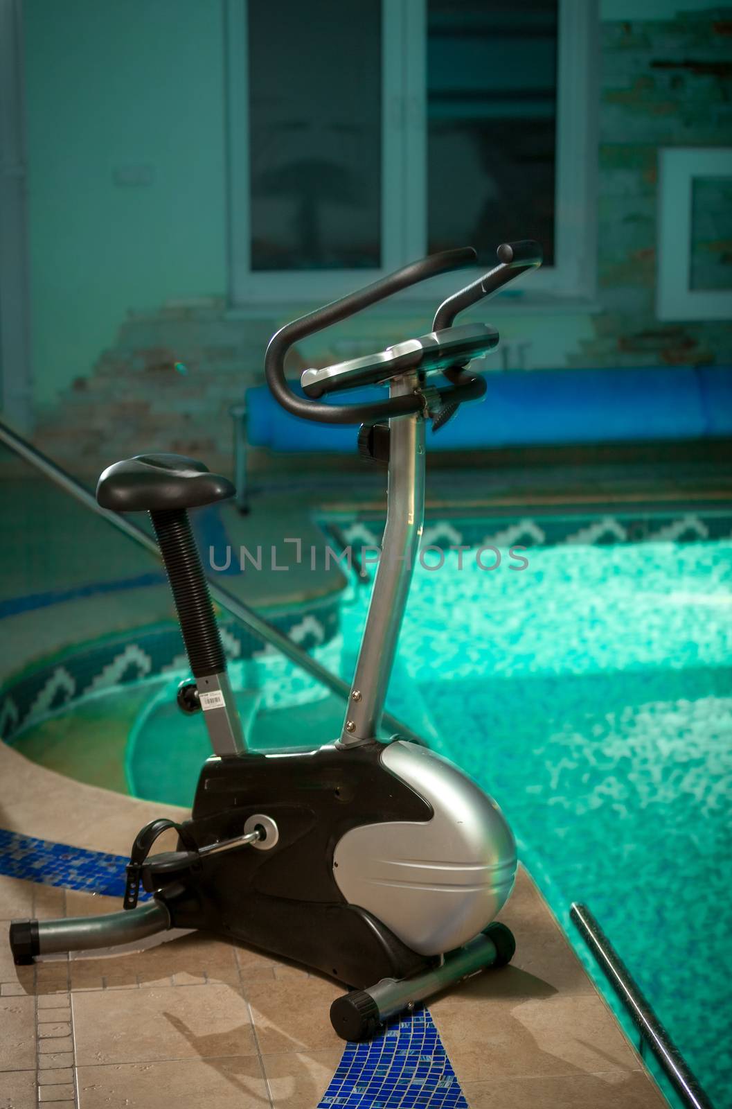 Exercise bike standing at swimming pool