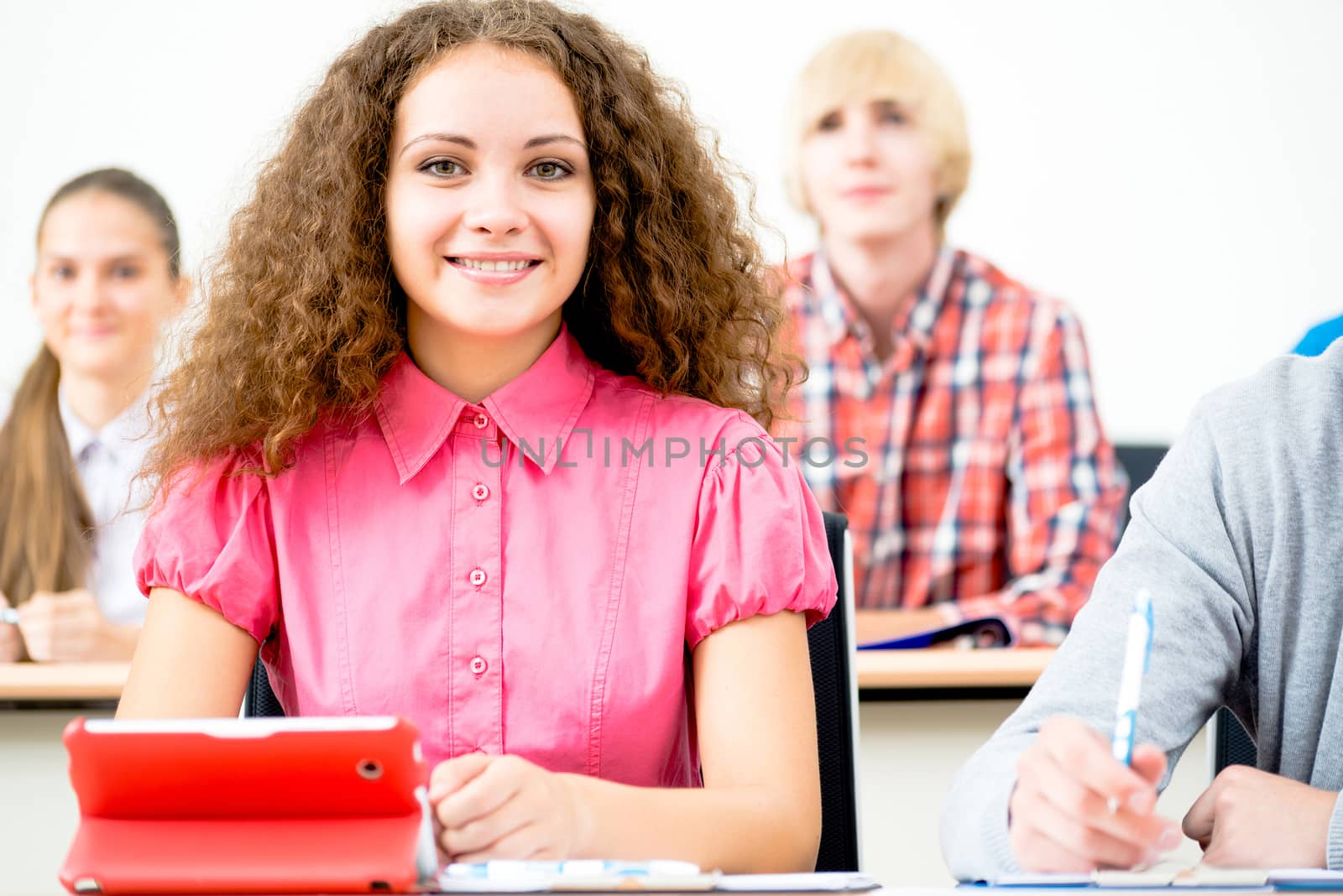 portrait of young female student in the classroom, teaching at the University of